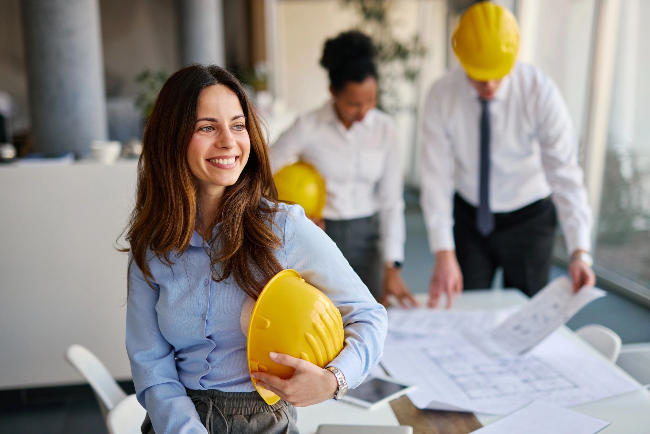 Early-career construction professional in an office environment