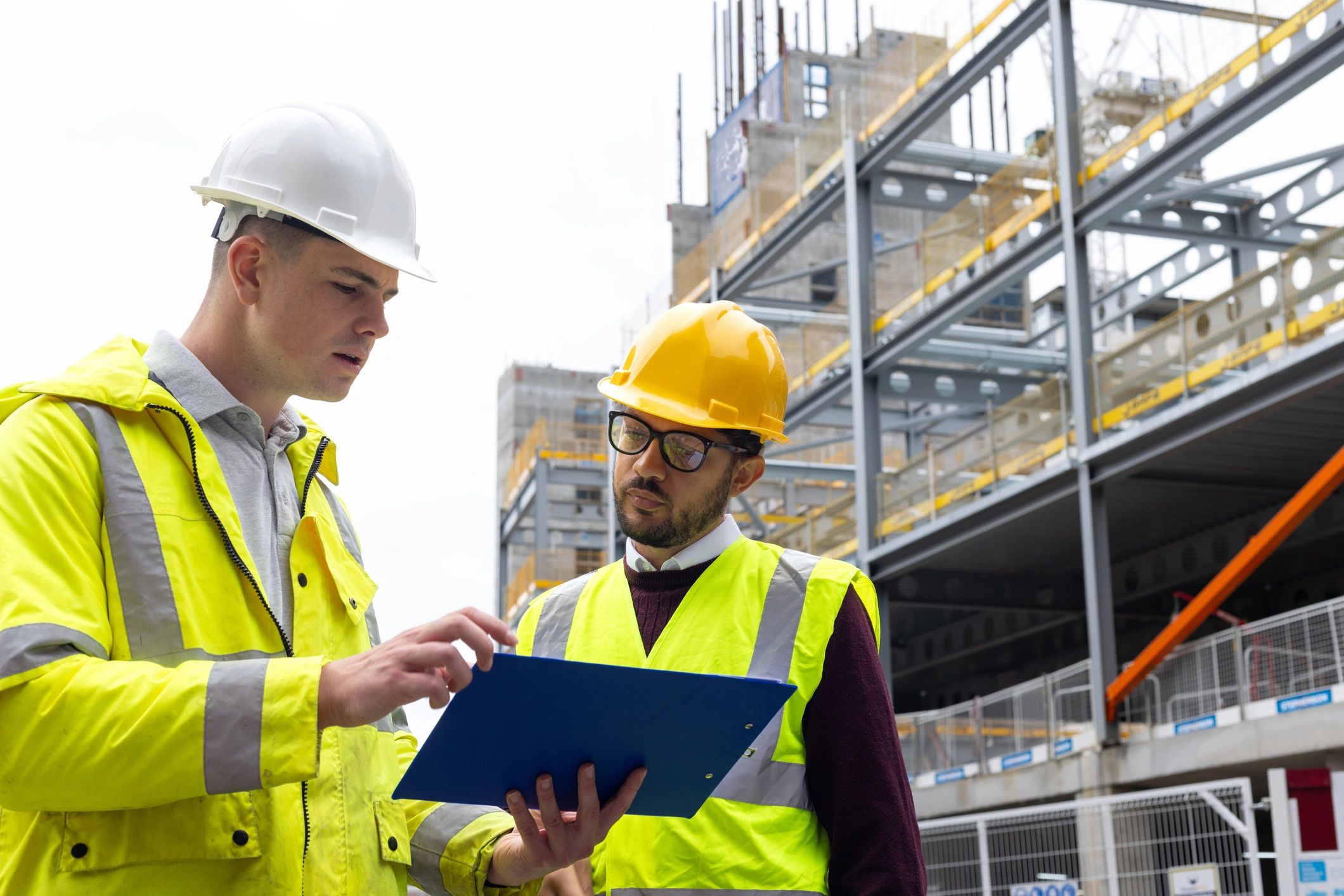 Engineers reviewing plans at a construction site